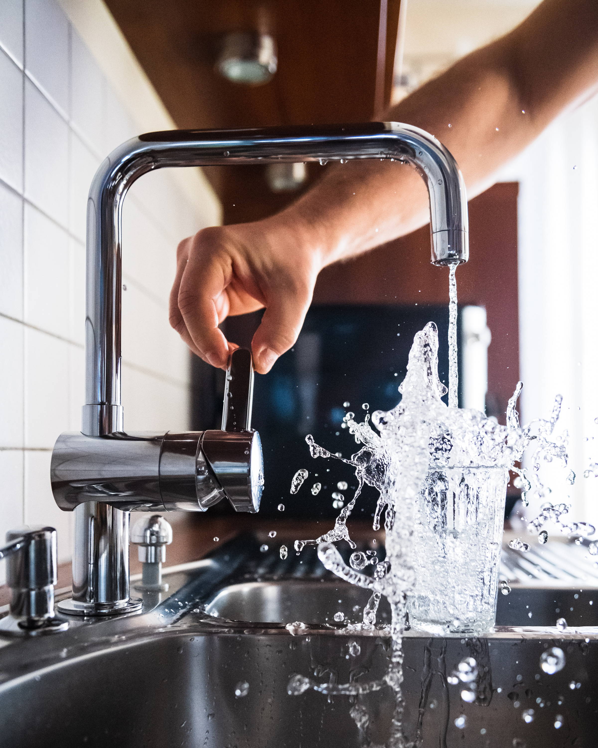 Filling up a glass with tap water