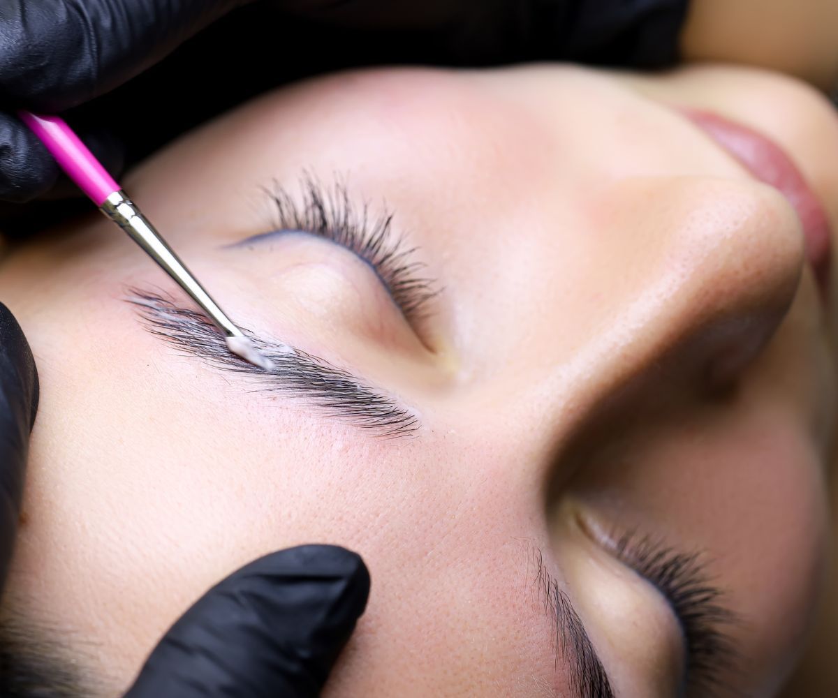Person having brow lamination solution applied to their brow.