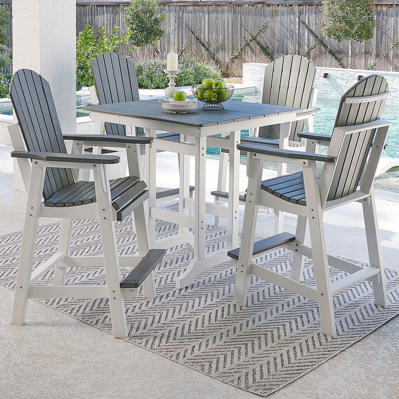 Outdoor dining set with high chairs and a square table on a patio.