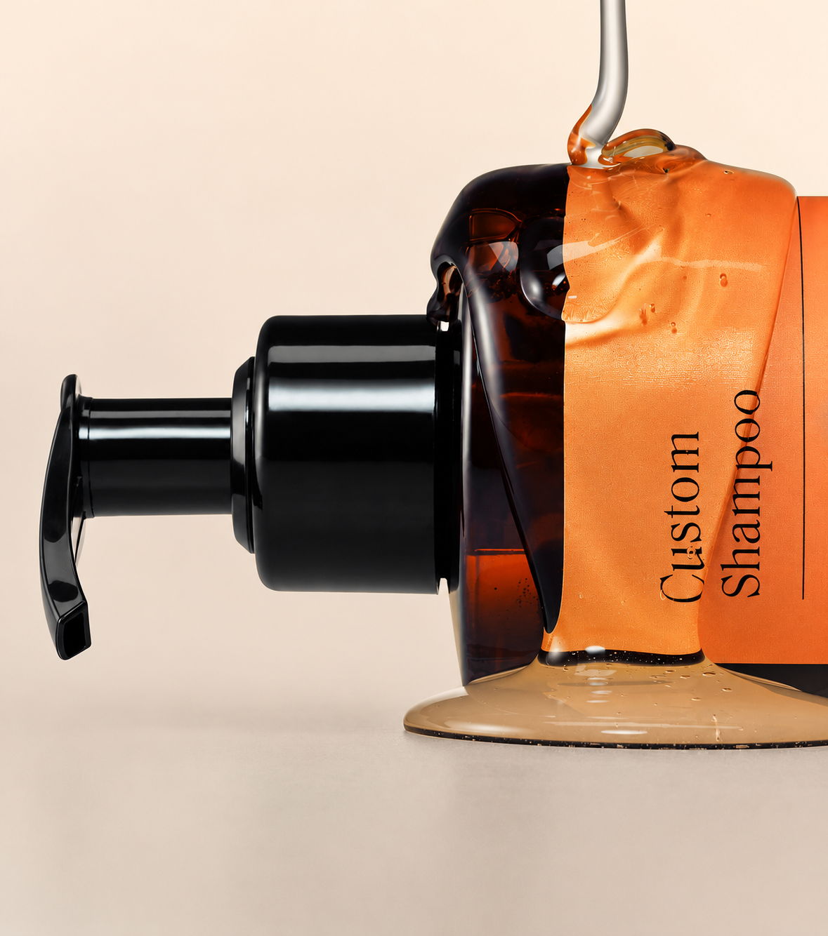 Bottle of custom shampoo with an orange label and pump dispenser.