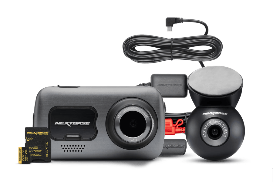 Dashcam with accessories including camera, cables, and mounting hardware.