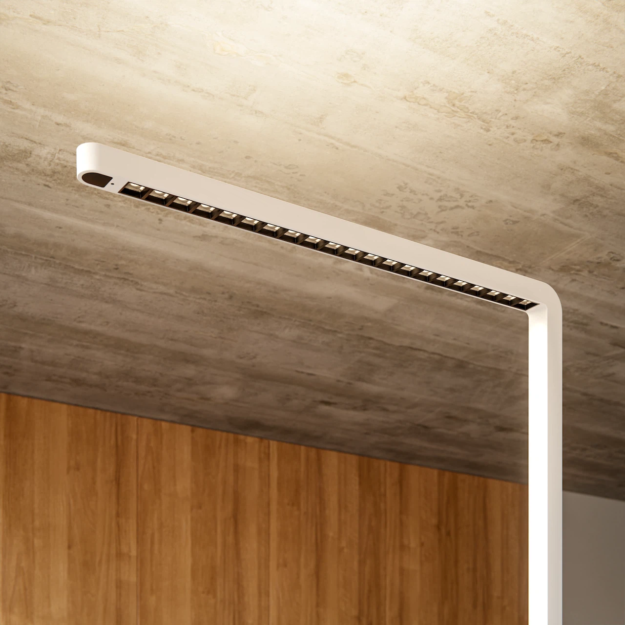 Bottom view of the white lamp head of the " Lumino Pro" floor lamp, featuring a visible LED grid and indirect light, against a concrete ceiling.