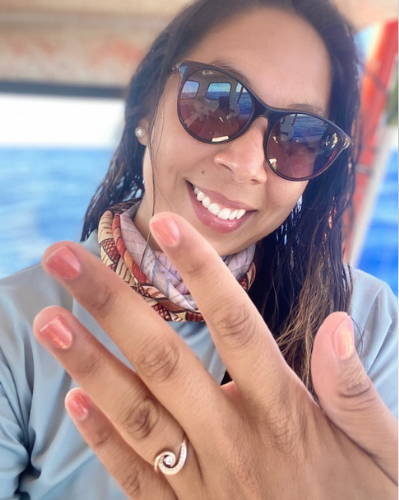 woman holding hand up to show her nails with non toxic nail polish