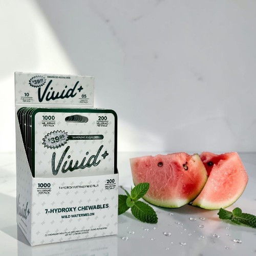 Box of Vivid+ watermelon-flavored items with watermelon slices and mint leaves.