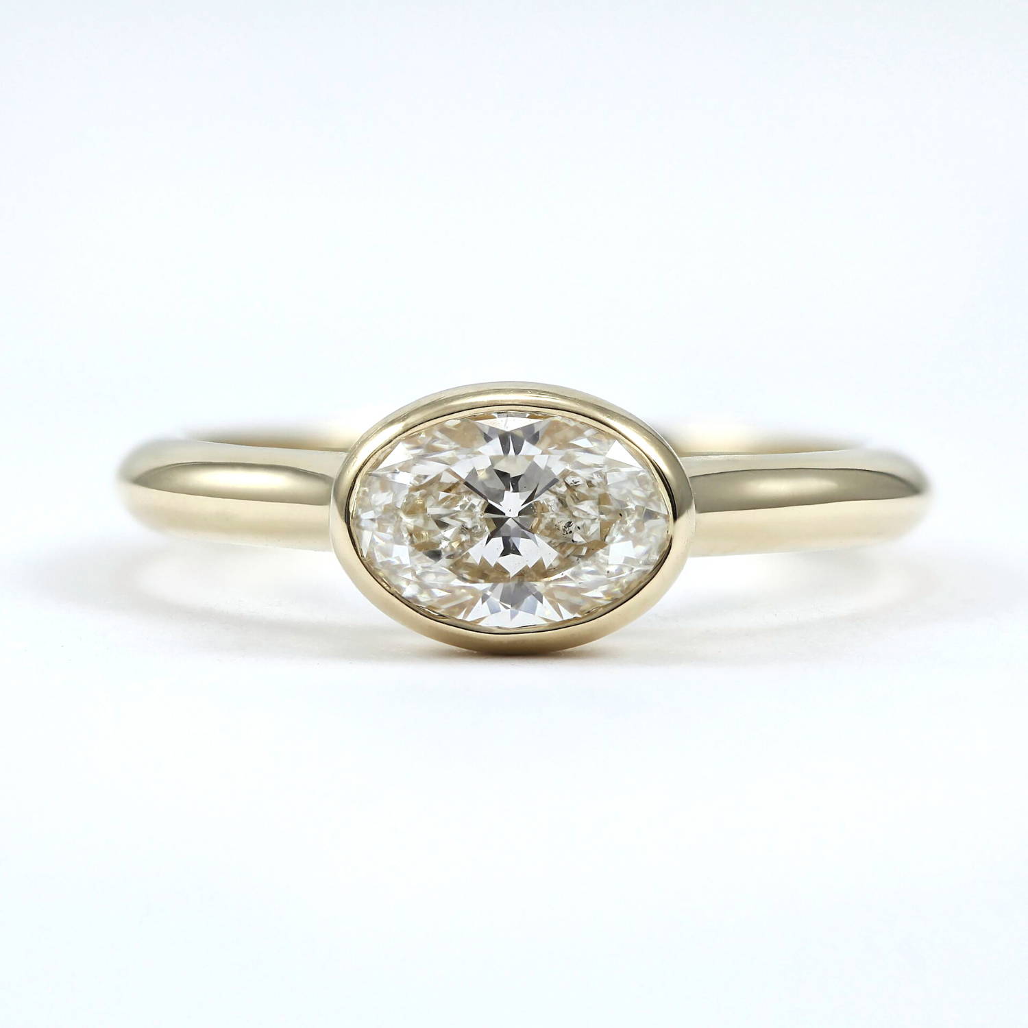 east-west oval diamond solitaire ring