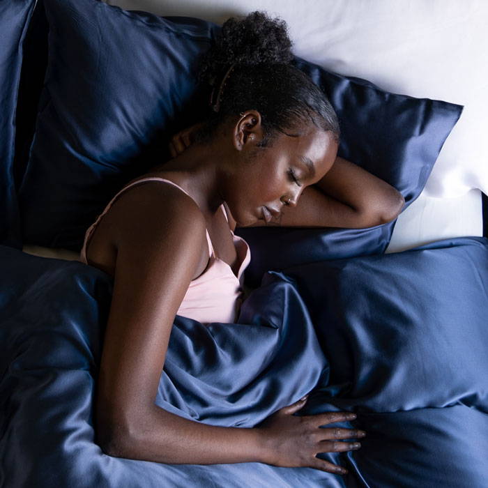 girl sleeping in silk sheets