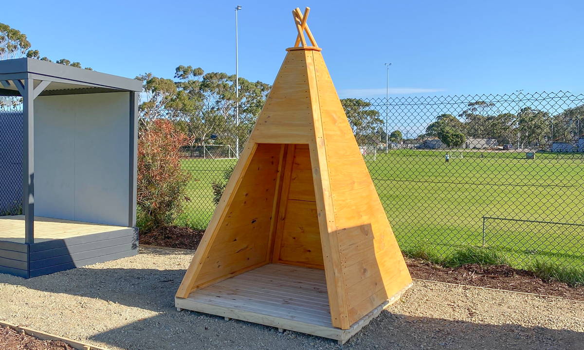 A timber teepee cubby house 