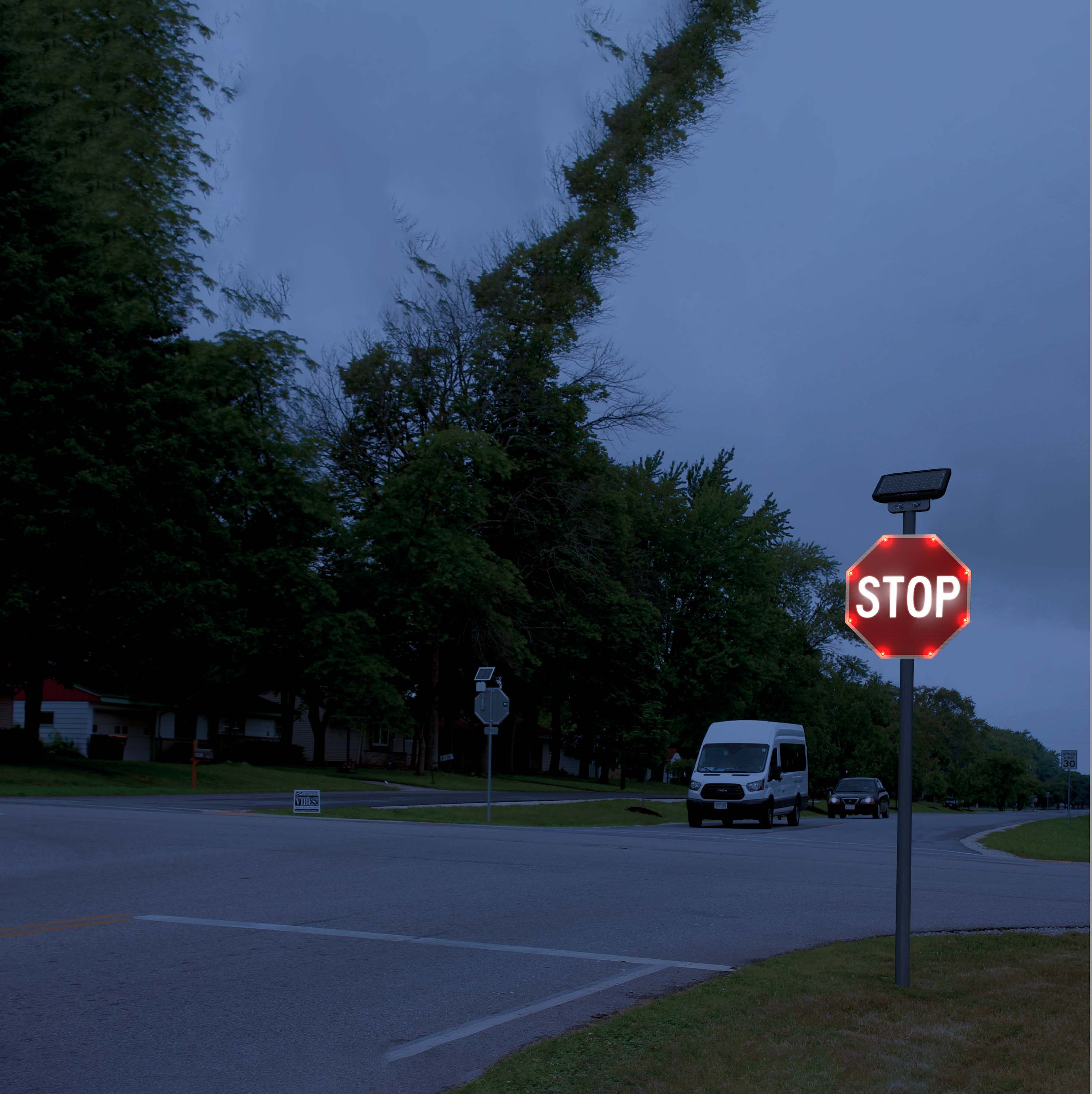 A flashing stop sign placed at an intersection.