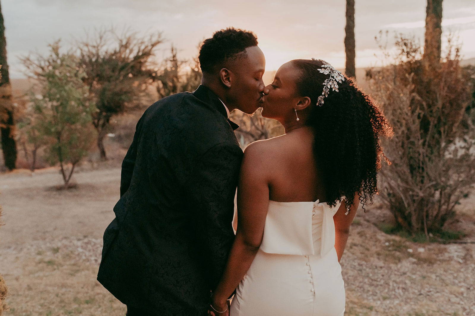 Bride and Groom sharing a kiss with mountain view