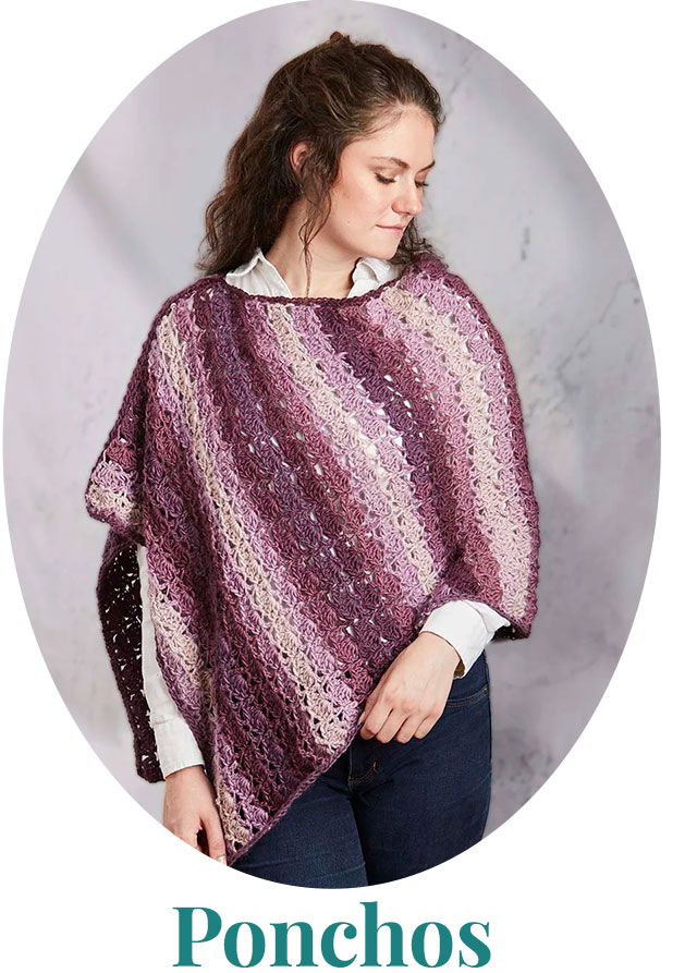 Woman wearing a purple and pink striped poncho.