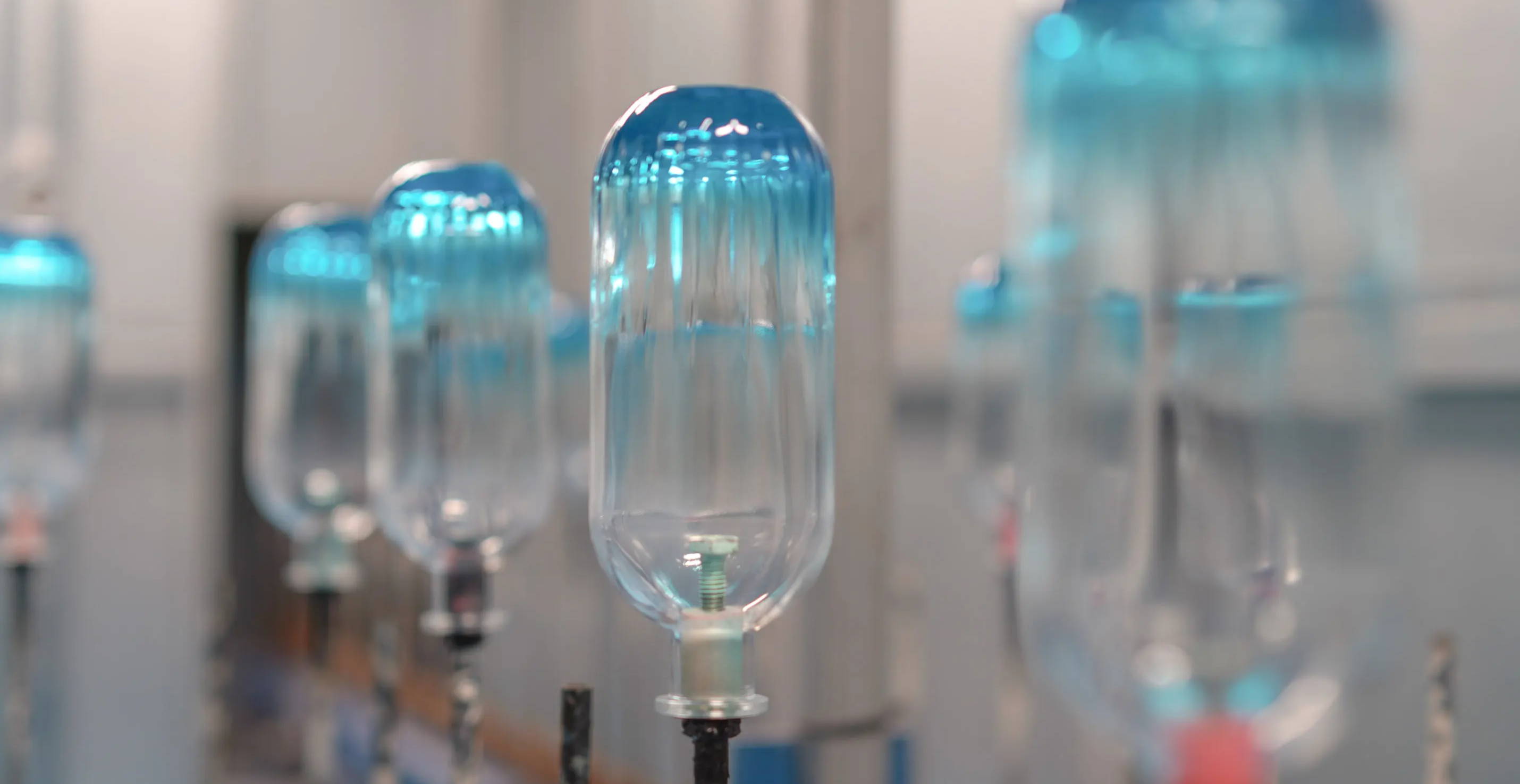 Glass drinks bottles being coloured