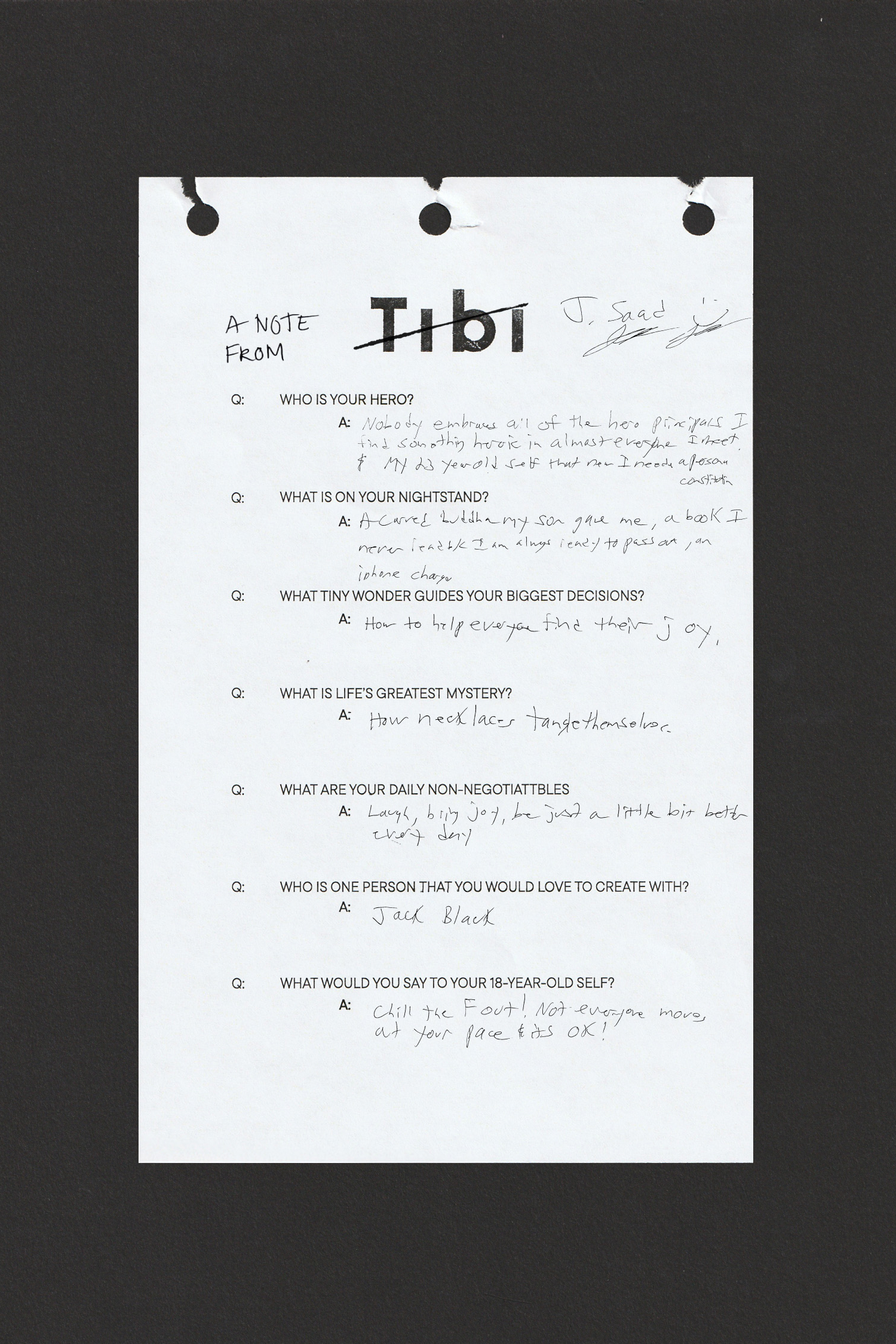 A handwritten note on a torn sheet of paper with questions and answers.