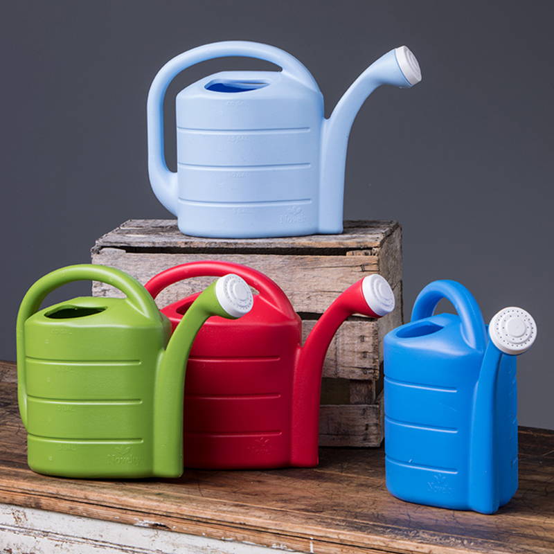 Display of each 2 gallon deluxe watering can color, including sky blue, blue, red, and green