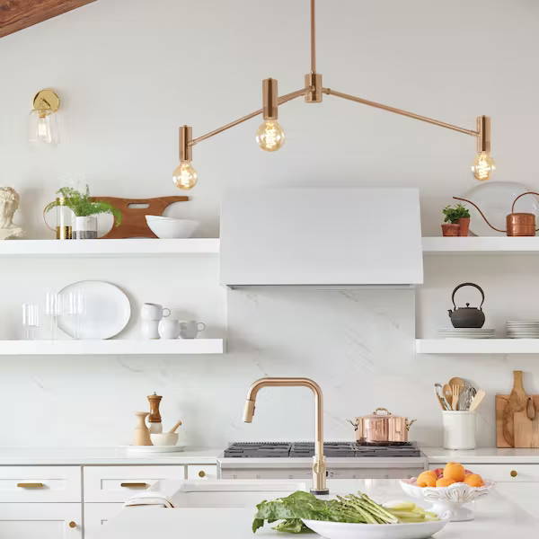 Brass chandelier in white kitchen