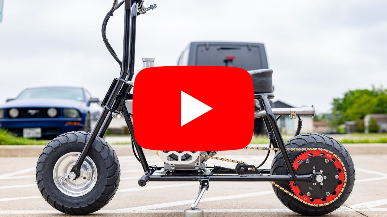 Electric scooter with a YouTube logo overlay in the foreground.