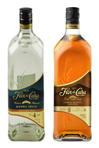 Two bottles of Flor de Caña rum, one white and one dark.
