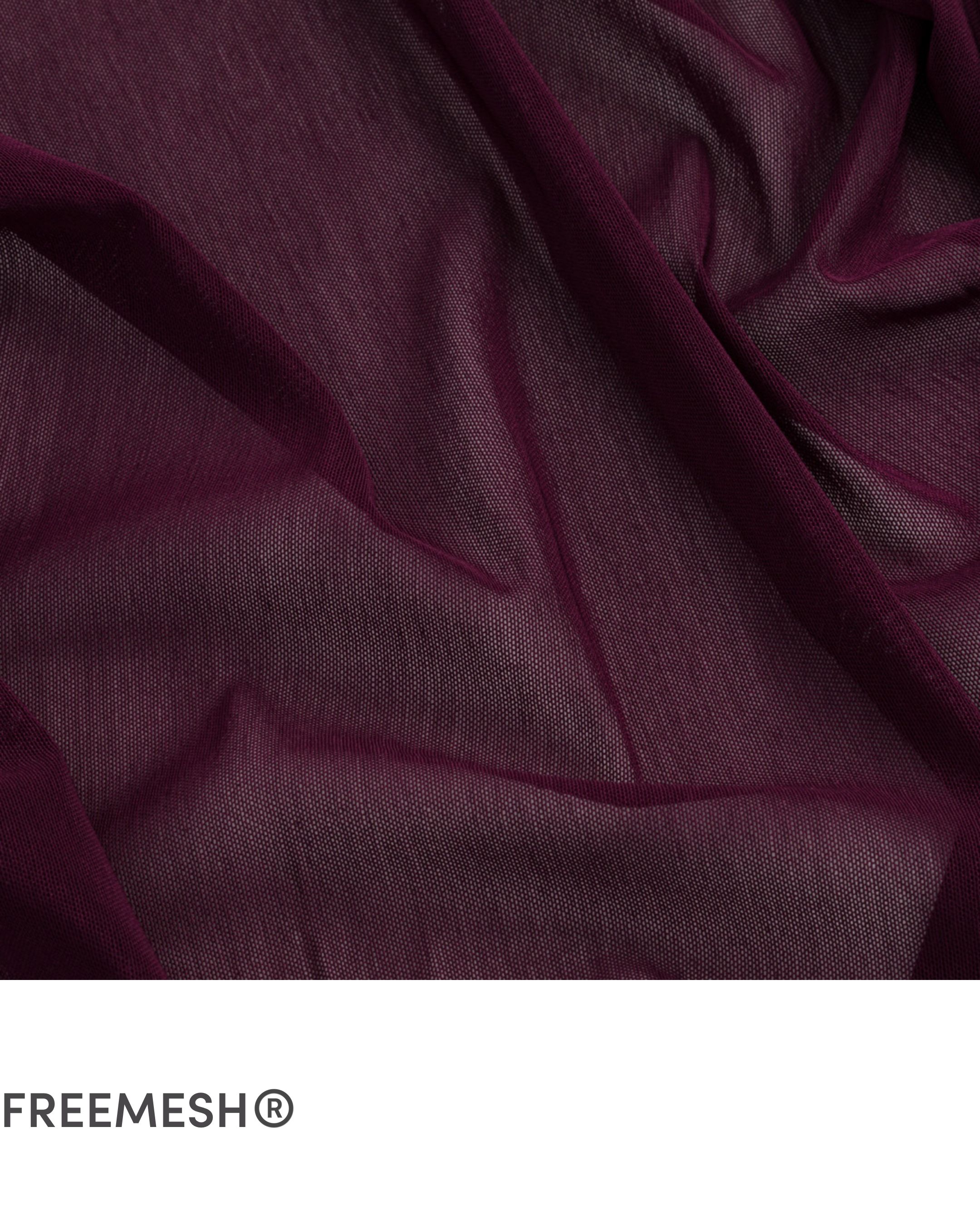 Close-up of burgundy fabric with folds and texture.