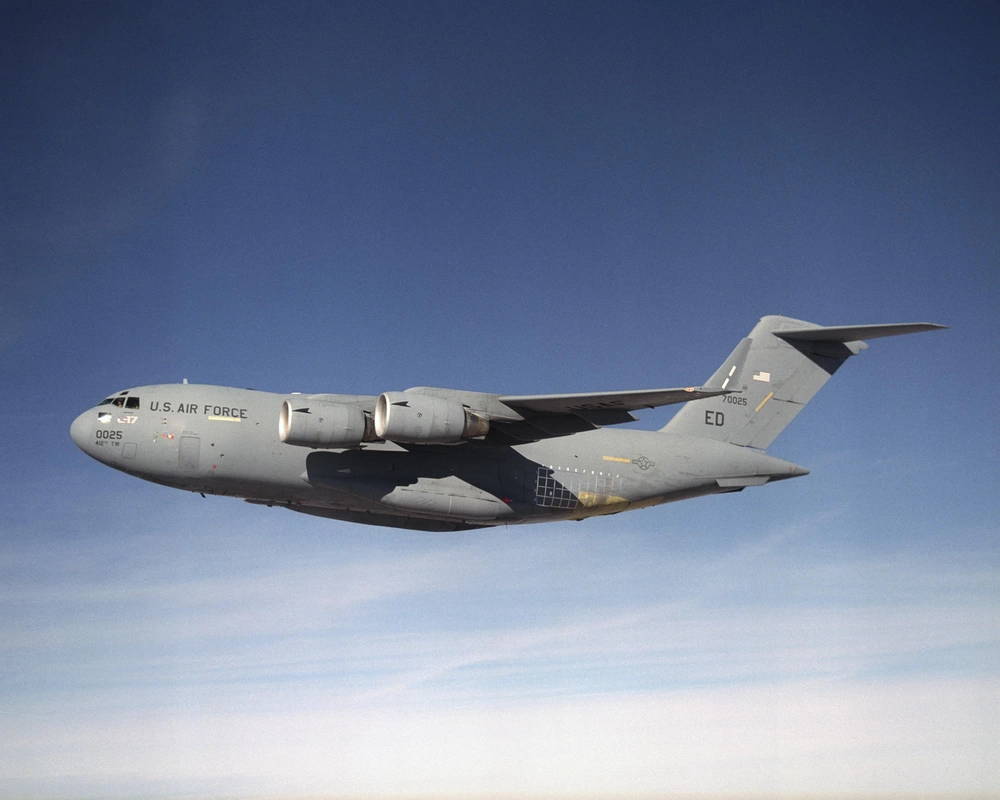 U.S. Air Force C-17 transport aircraft, tail number 0025, is being used by NASA Dryden and other NASA centers, the U.S. Air Force, Boeing, and Pratt Whitney in the Propulsion Health Management PHM portion of the Integrated Vehicle Health Management IVHM program. The program is using a USAF C-17 transport in an effort to enhance aircraft safety by enabling early electronic detection of potential problems with aircraft engines and associated systems. December 4, 2003 NASA Photo / Jim Ross C-17 Project Description