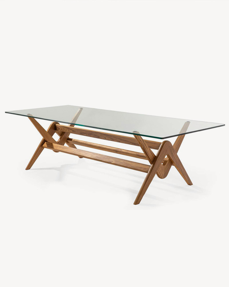 A modern Cassina dining table with a glass top and wooden base.
