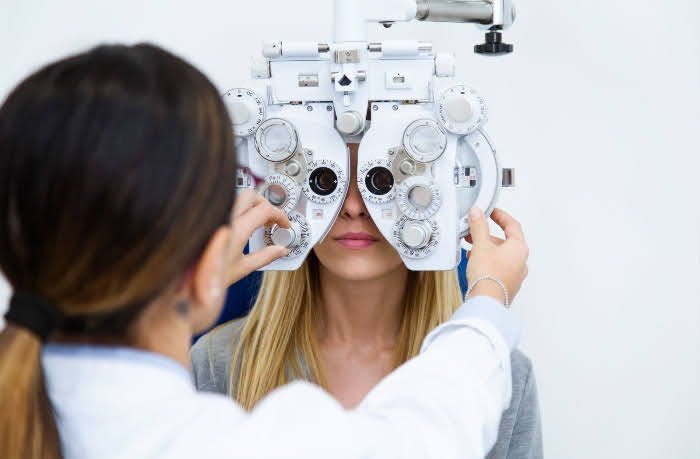 woman getting an eye exam in an optometrist office