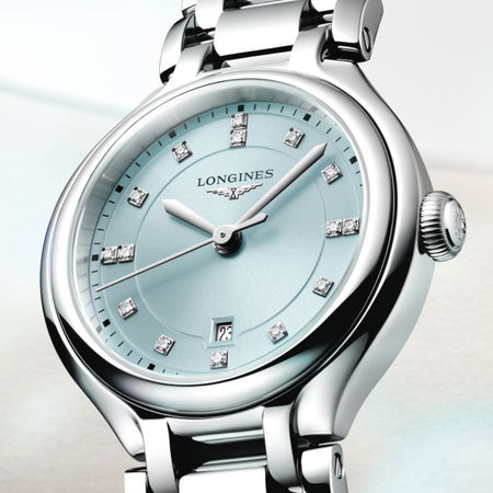 Silver watch with a light blue face and diamond hour markers.