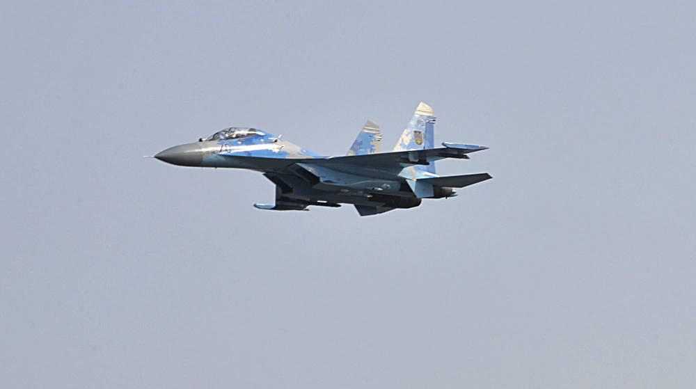 A Sukhoi Su-27 flies over the flightline during the opening ceremony of exercise Clear Sky 2018 at Starokostiantyniv Air Base, Ukraine, Oct. 8. The exercise promotes regional stability and security, while strengthening partner capabilities and fostering trust. (U.S. Air National Guard photo by Tech. Sgt. Charles Vaughn)