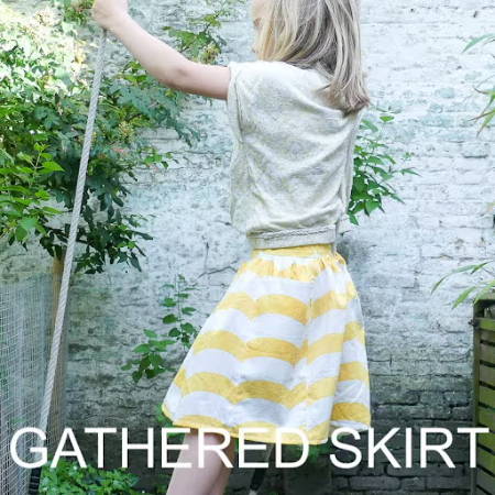 Girl wearing a yellow striped handmade gathered summer skirt