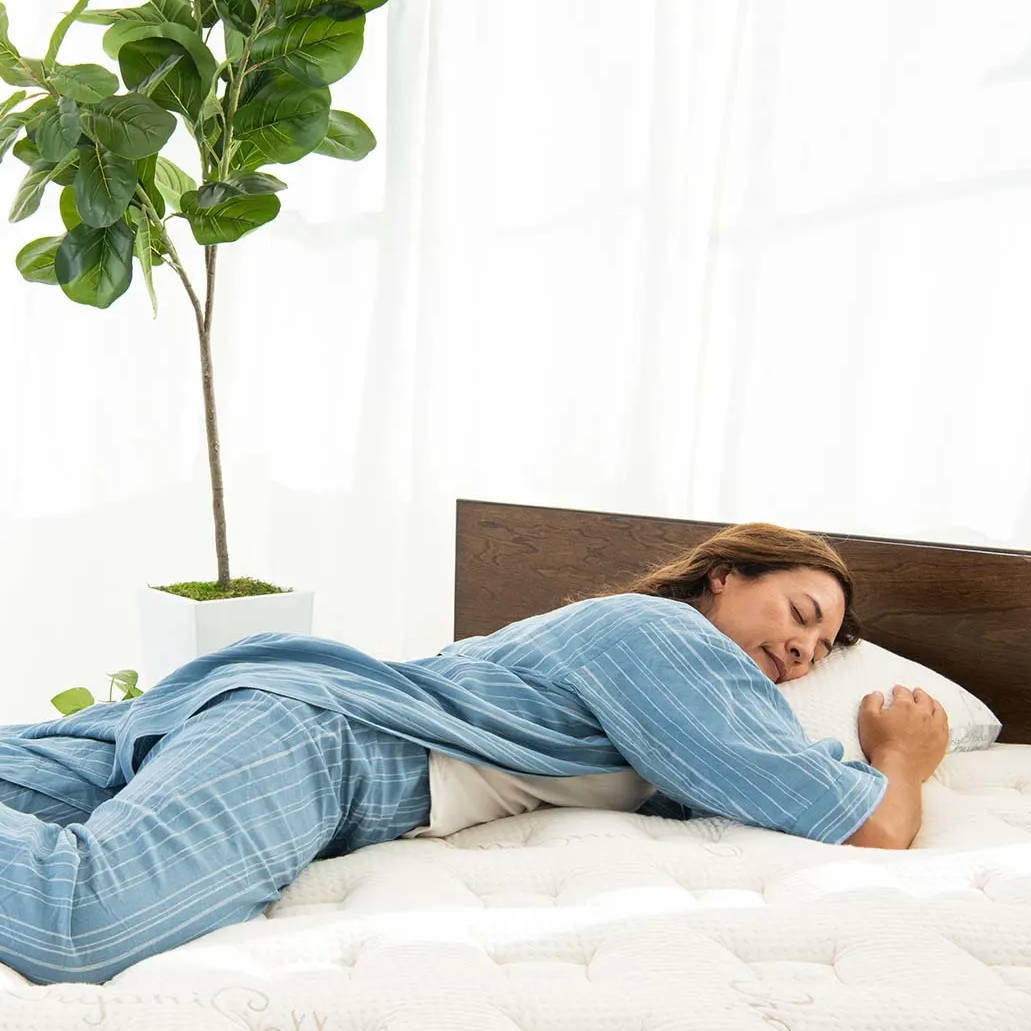 woman laying comfortably on nest mattress