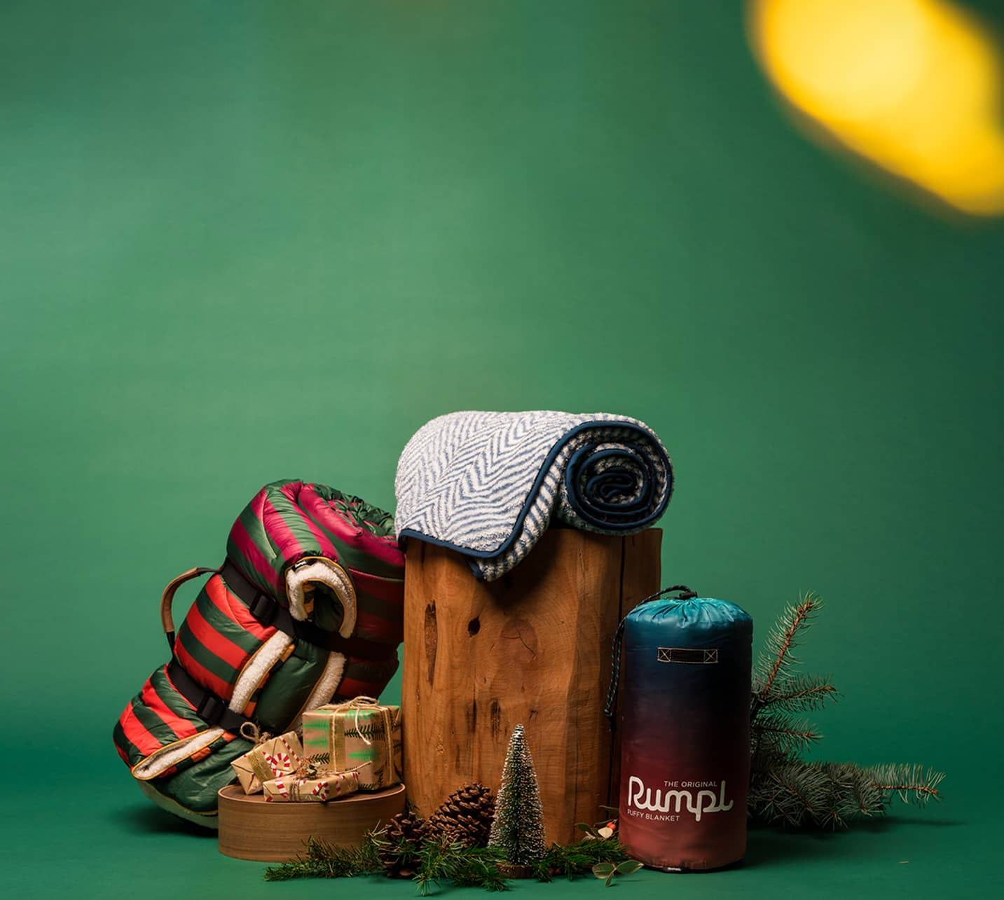 Log with Sherpa Fleece, Sherpa Puffy and Original Puffy Blankets around it