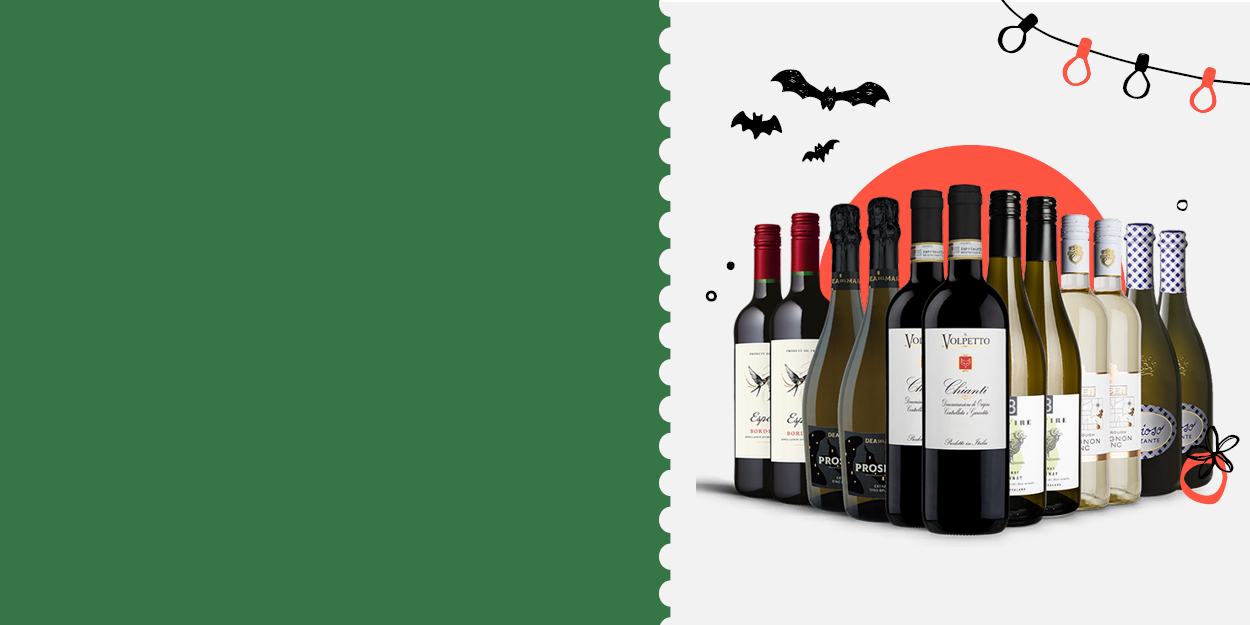 Assorted wine bottles with Halloween decorations in the background.