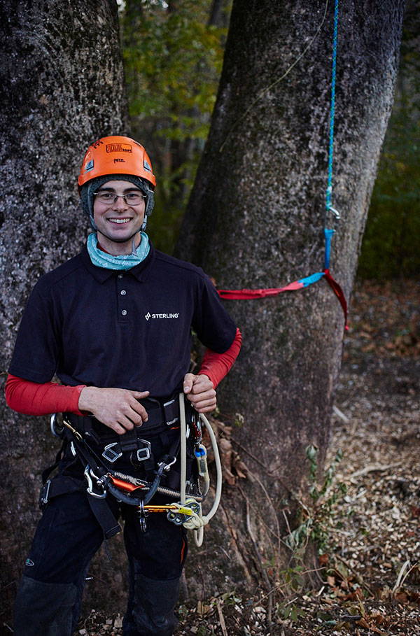 Kyle McCabe posing in front of tree