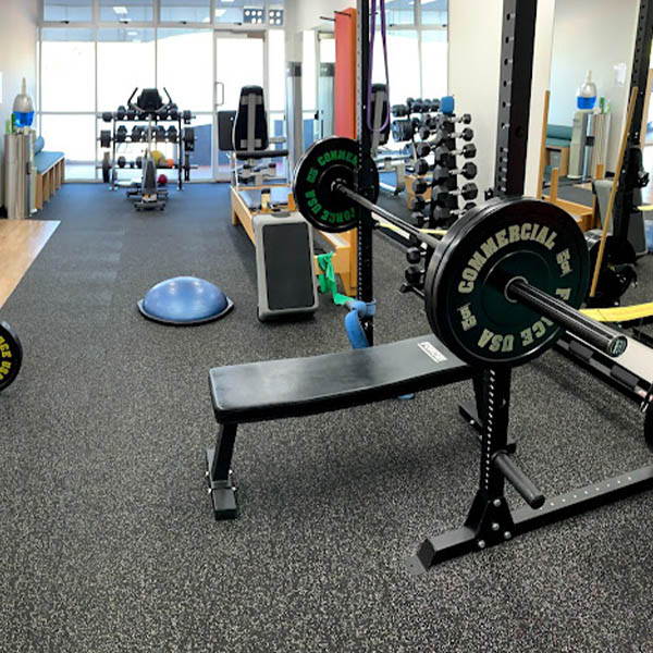 Physiotherapy Gym Fit Out. An inclusive look at the clinical atmosphere, highlighting exercise gear for rehabilitation.