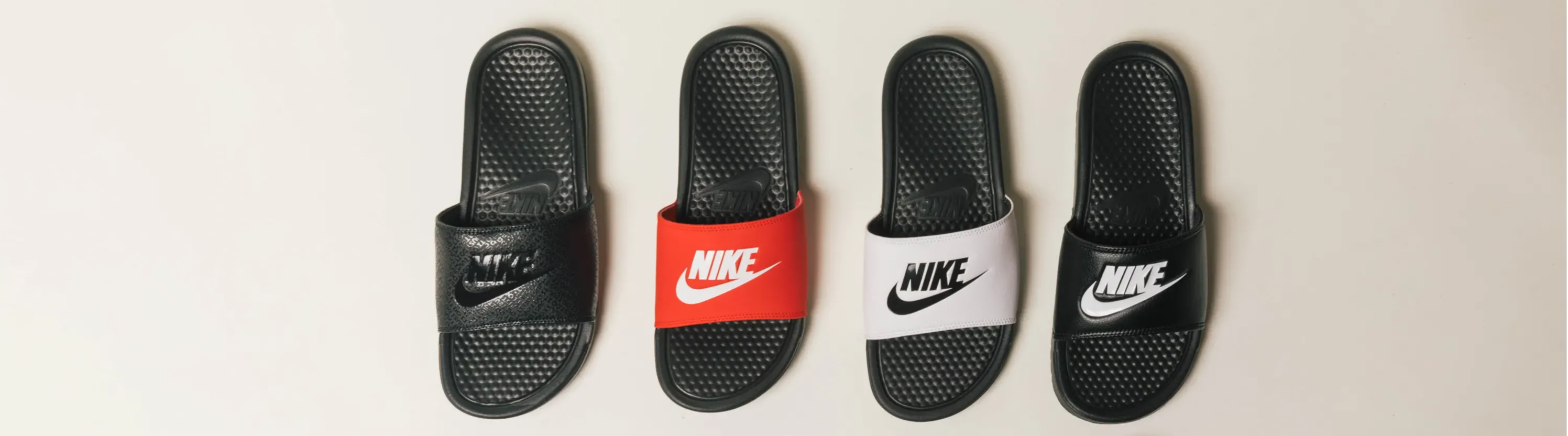 four colors of nike slides top view