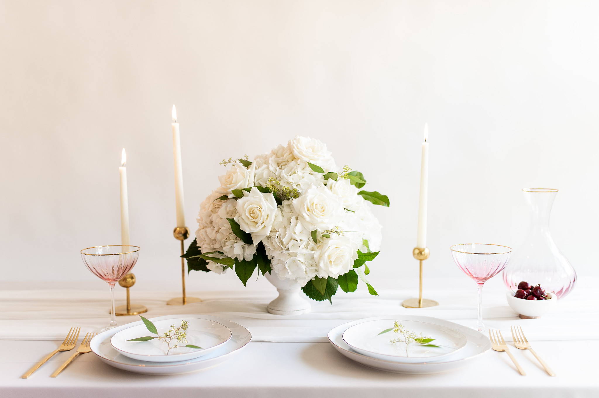 hydrangea and rose and lemon leaf rounded centerpiece compote