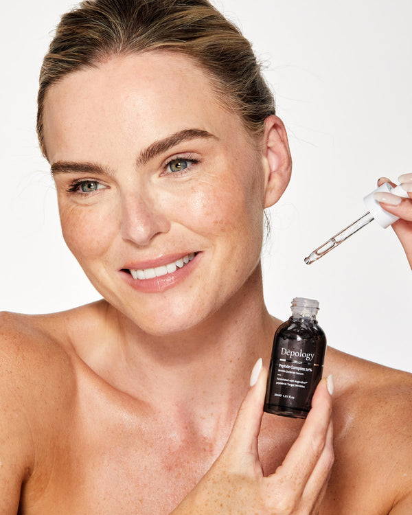 Women in her early 40ss using Peptide complex serum from Depology skincare 