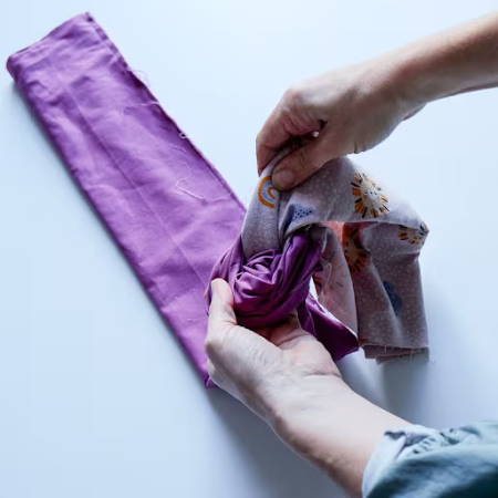 pulling the main fabric out of the magenta band fabric