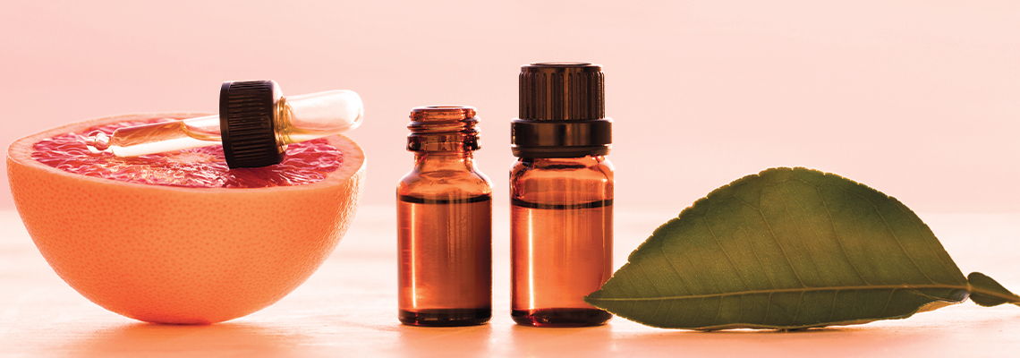 Aromatic oils and fresh fruit in a serene setting.