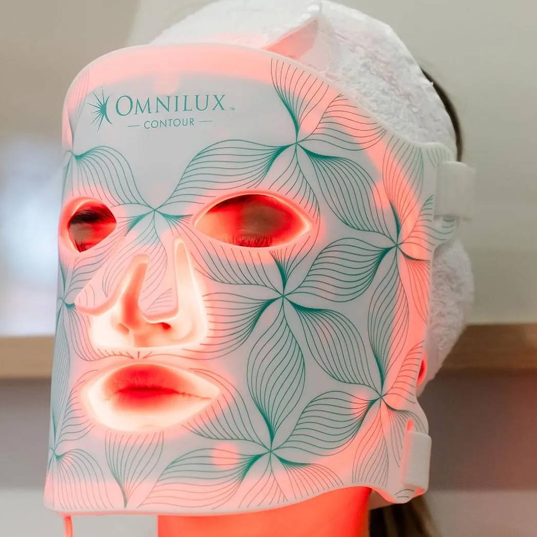 Woman wearing Omnilux LED Light Contour Face mask