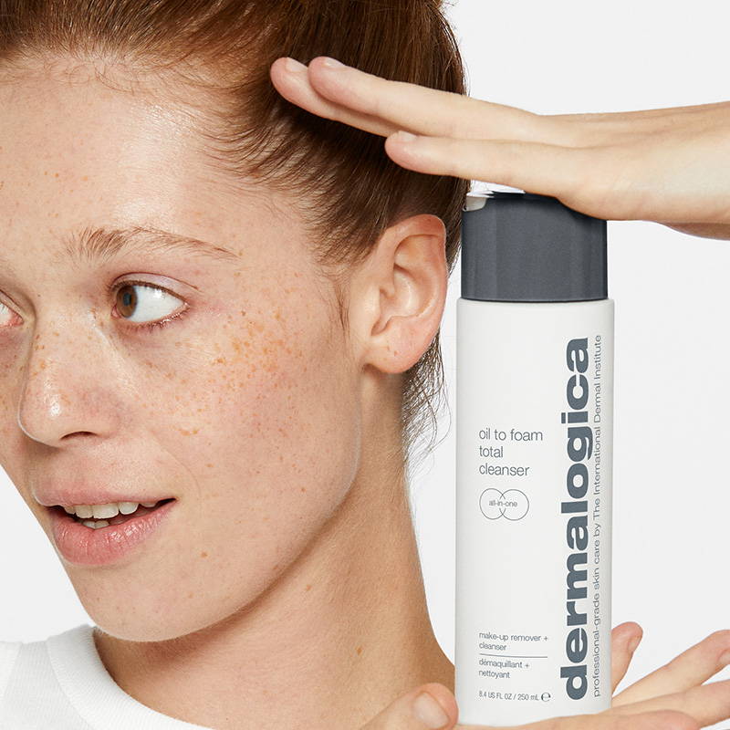 New Oil to Foam Total Cleanser Dermalogica - model holding product