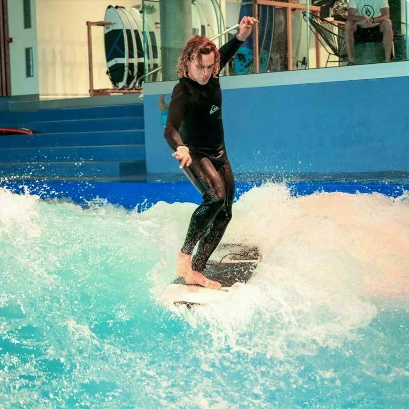 Person surfing KANOA Performance foamie Surfboard