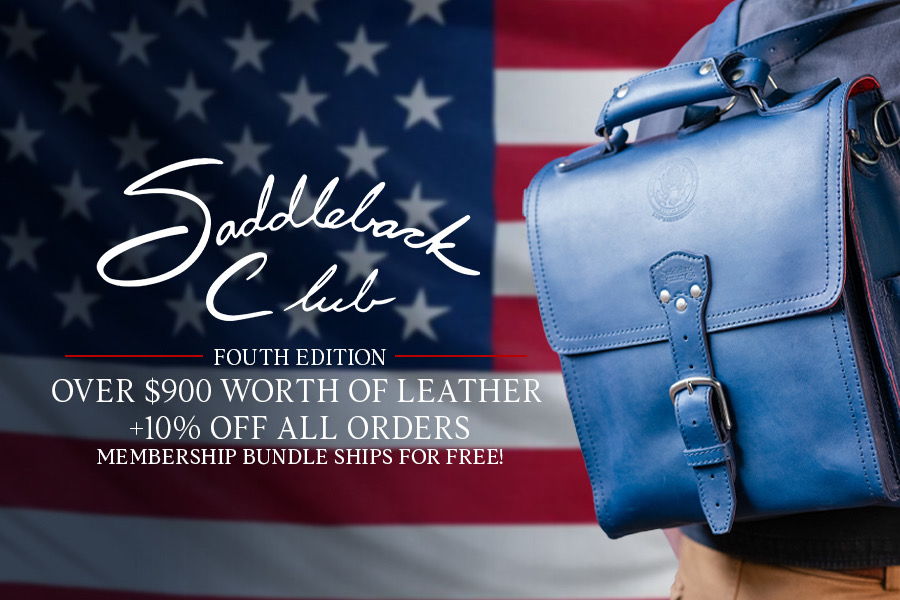 Saddleback Club promotion with blue leather bag and American flag background.