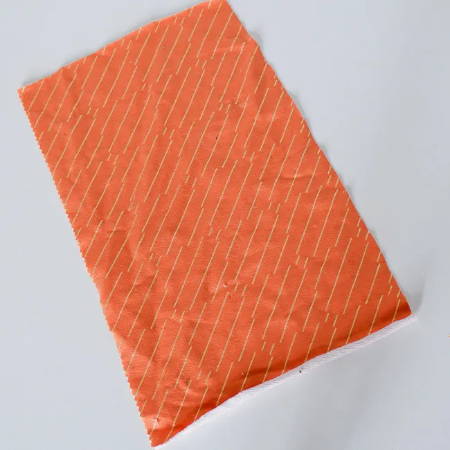 Rectangular orange fabric piece to make a pumpkin