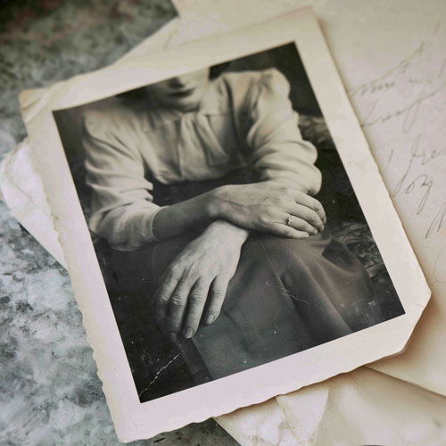 Vintage photo showing a woman's hands with a ring