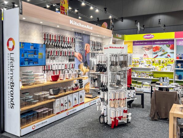Display of kitchenware products at a trade show booth.