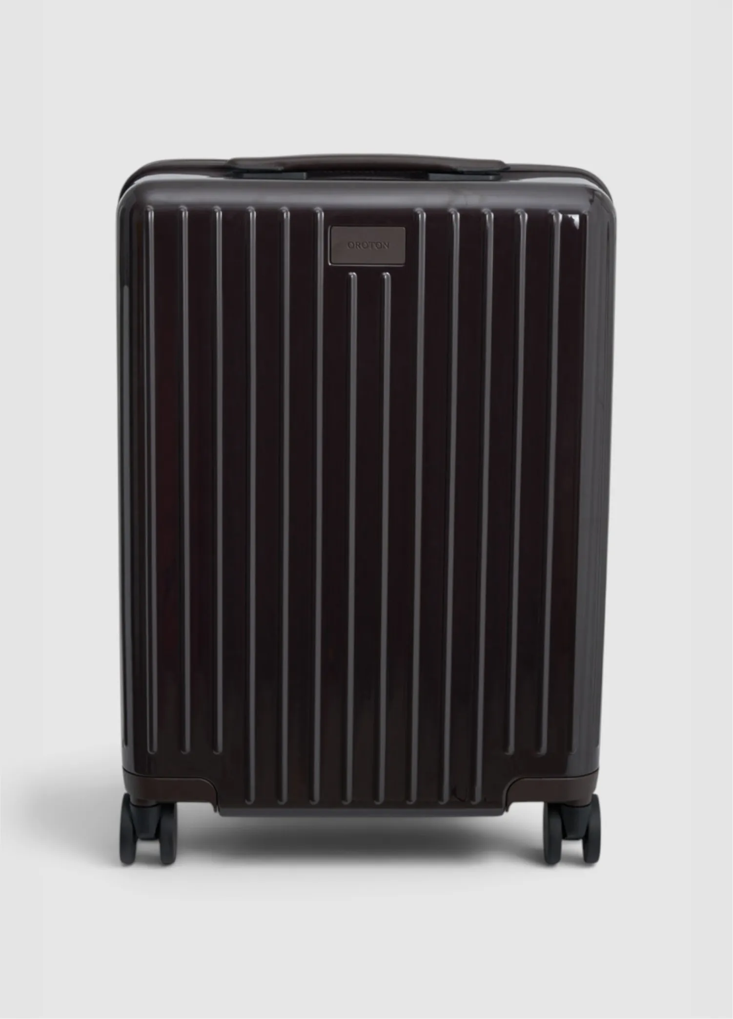 Black suitcase with vertical stripes and wheels, front view.