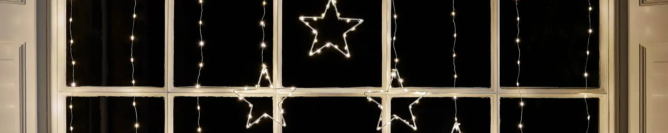 Osby star curtain light illuminated in window