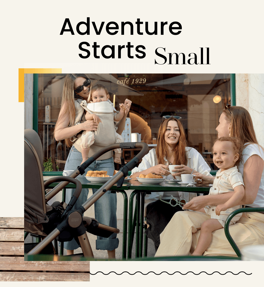 Two women and two children at a café table, enjoying snacks and drinks.