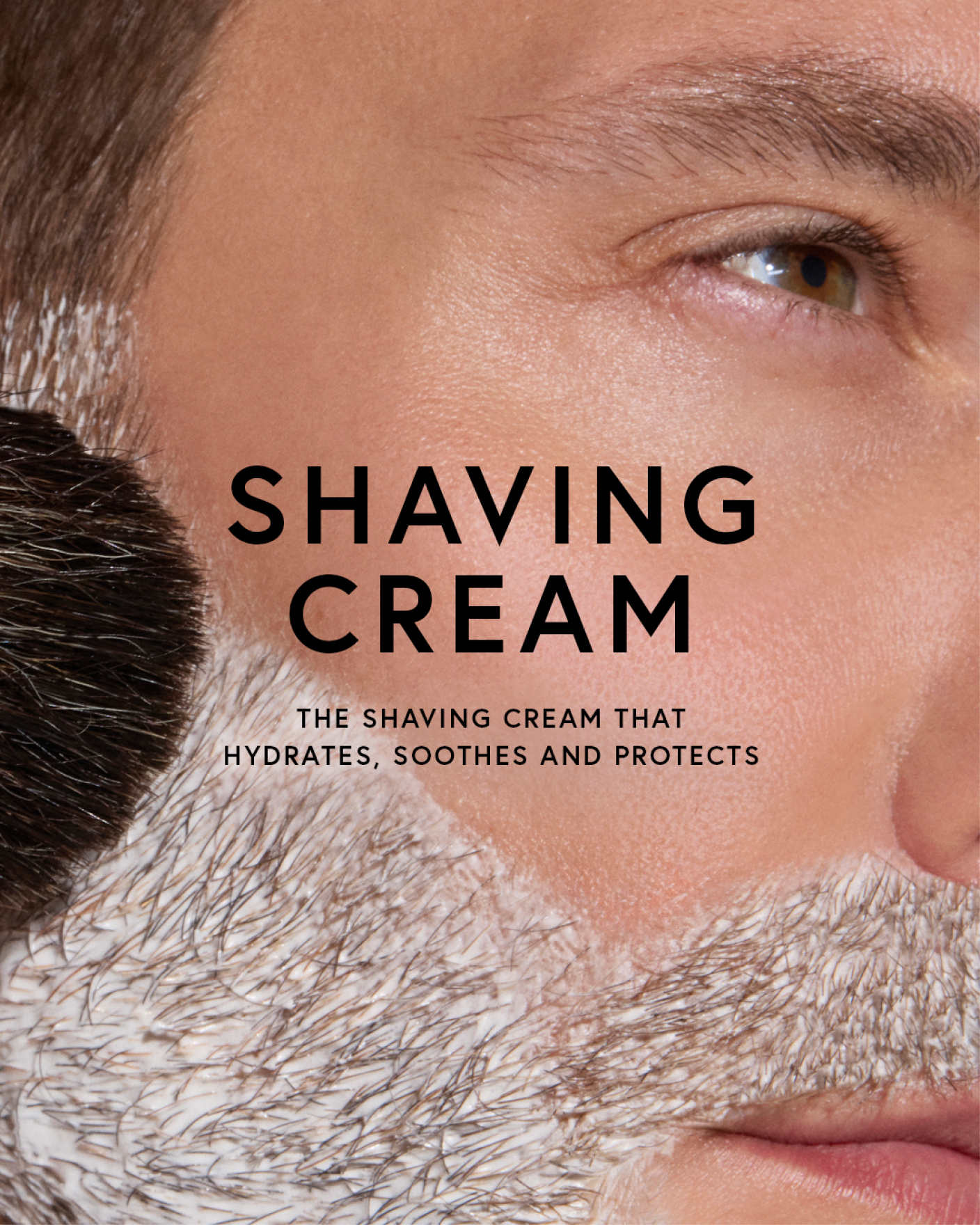 Close-up of a man's face with shaving cream and text about the product.