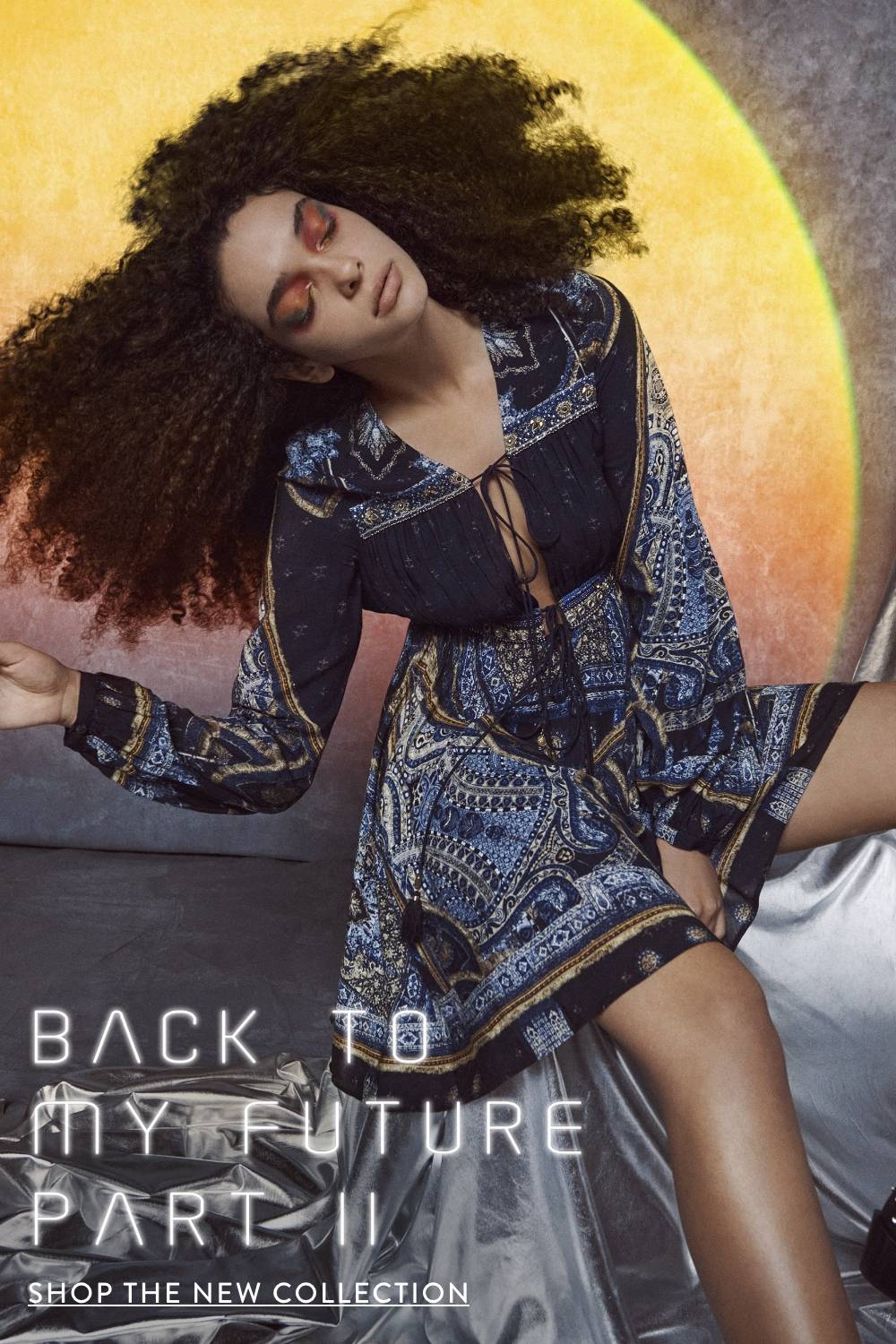 CAMILLA | BACK TO MY FUTURE PART II | SHOP THE NEW COLLECTION | Model wearing navy blue long sleeve mini dress in forever family print