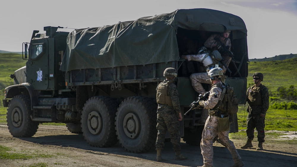 U.S. Marines with the 15th Marine Expeditionary Unit (MEU) Maritime Raid Force (MRF) board a tactical vehicle after successfully conducting a raid as part of MUE-EX, the first major exercise the MEU conducted as a composite force, at Camp Pendleton, Feb. 9, 2017. This exercise affords the opportunity for Marines from supporting units to begin training side by side with the MRF in preparation for deployment. The pre-deployment training the 15th MEU is conducting ensures the Marines and Sailors are prepared to answer the Nation’s call should the need arise. (U.S. Marine Corps photo by Lance Cpl. Frank Cordoba)